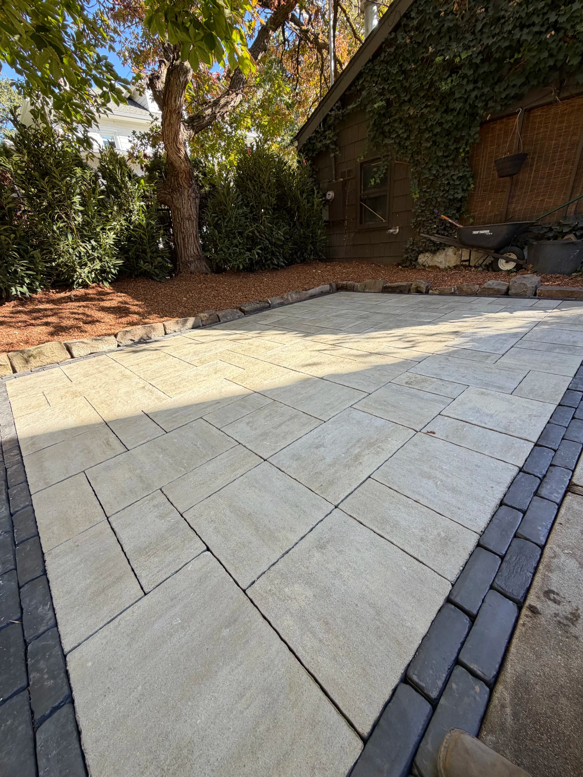 From Dirt and Leaves to a Paver Patio Worth Using image